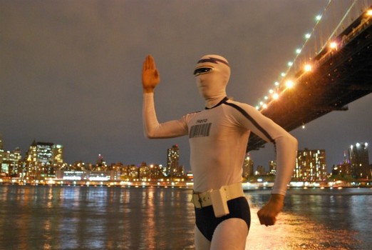 Captain Generica strikes a generic pose in front of the Manhattan Bridge.